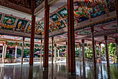 Vientiane, Laos - Pha That Luang, among the Other structures on the ground there is an open sala decorated with brightly colored paintings.  